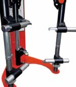 Close-up of the Branick 7600 spring compressor’s lower hook assemblies attached to the threaded guide rods, showing the clamp design and adjustment points