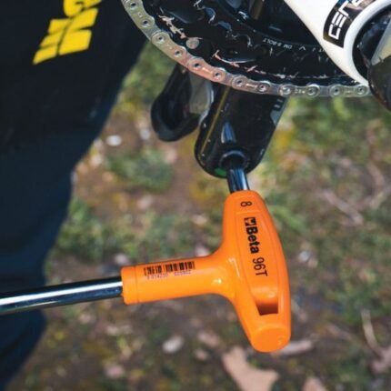 A Beta Tools 3-Offset Hexagon Key Wrench tightening a bicycle crank bolt, showing precise control and ergonomic T-handle design. Get it at Wrenchers.com.