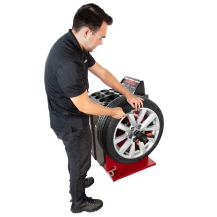 APEX AB28 wheel balancer with LED weight placement indicators and digital display