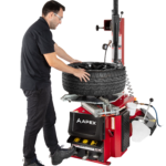 APEX AT26 swing arm tire changer for passenger and light truck wheels in a small shop setting