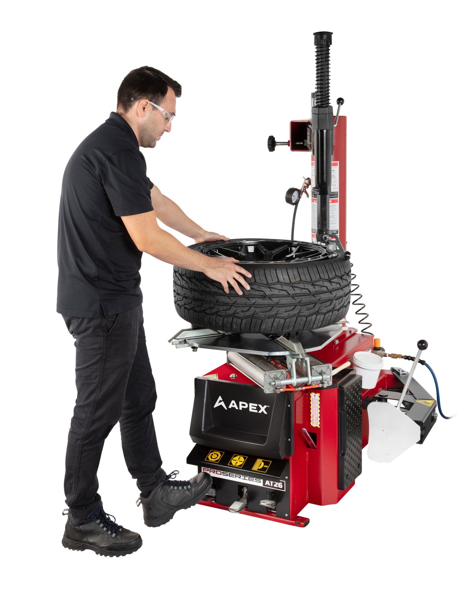 APEX AT26 Swing-Arm Tire Changer APEX AT26 swing arm tire changer for passenger and light truck wheels in a small shop setting