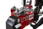 Angled view of the Coats APX90E chassis showing the clamping table, foot controls, APX90E control decals, and adjacent assist arm system