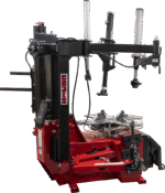 Side view of the Coats APX90 tire changer showing the assist arms, mounting tower, and red chassis with exposed operating mechanisms