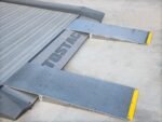 Autostacker low-clearance vehicle ramps offering smooth approach angle and easy attachment to lift system.