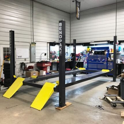 BendPak HD Series four-post lift transforms garages into clean, professional-grade vehicle storage systems.