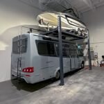 HD-7500PBX four-post lift doubling as a professional-grade car and boat storage solution for garages or marinas.