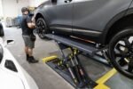 See the BendPak MDS-6LP mid-rise lift at work in a professional shop, delivering reliable lifting and open-center access.