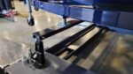 BendPak HD-75BXT 4-post lift with extended runways for boat and vehicle storage, featuring durable steel construction.
