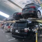 Two cars in one spot in parking lot