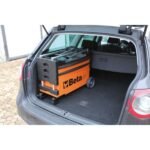 Beta Tools C27S-O folding tool trolley stored in a car trunk, highlighting its compact, collapsible design for easy transport between job sites. Get it at Wrenchers.com