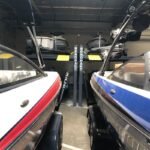 Multiple boats stored safely on HD-7500BLX four-post lift. Built for serious storage.