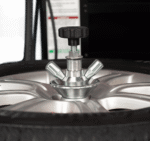 Center clamp wheel clamping system on the Hofmann Monty 3550EM-SS securing alloy wheels through the hub for scratch-free tire service
