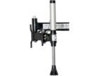 Close-up of the Coats RC-55A assist arm tool, showing the vertical press cylinder, mounting bracket, and rubber-tipped press head used for tire mounting support