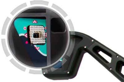 Close-up of a wheel alignment target showing the reflective marker pattern used by the imaging system