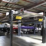 Trailer storage made simple with BendPak four-post lift strength and stability.