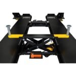 Top-down view of alignment lift center section showing scissor-style rolling jack and hydraulic components between runways