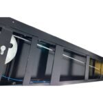 Underside view of four-post lift runway highlighting cable routing, pulleys, and internal lift mechanism