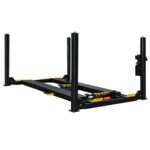 Four-post automotive alignment lift shown on a white background with steel runways, adjustable wheel stops, and heavy-duty columns