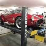 Home garage 4 post lift for car storage. Clean design, reliable lifting, and space-saving performance.