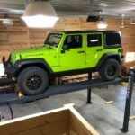 HD-9 5175861 handles SUVs and lifted Jeeps with 9000-lb capacity and garage-ready design.