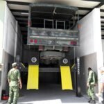 BendPak HDS-40X 5175178 lifting large military vehicles with 40,000-lb heavy-duty capacity.
