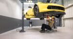 Chevrolet Corvette lifted for service on MaxJax M7K portable two-post car lift.