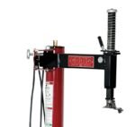Side view of a Coats tire changer manual swing arm assembly with a red support column, black horizontal arm, adjustment knob, and mounting head at the end