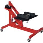 Norco 72674 power train lift model 6010214 with hydraulic foot pump, adjustable saddle, and swivel casters for engine removal.