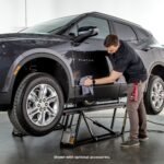 Auto detailing an SUV with the QuickJack 8000TL portable car lift bundle