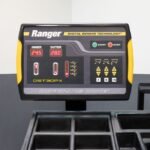 Automotive tire changer and wheel balancer equipment package with adhesive wheel weights
