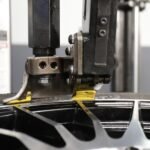 High-performance tire service setup featuring leverless auto bead lifter kit designed for faster installs and damage-free mounting.