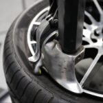 Leverless Auto Bead Lifter Kit installed on R76 tire changer, delivering fast, damage-free tire mounting for high-efficiency shop performance.