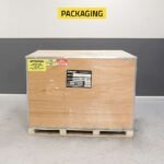 Secure, heavy-duty wooden crate packaging protects the Ranger R76ATR tire changer during shipping, ensuring safe and reliable delivery to any shop