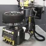 The Ranger R76ATR-L tire changer with 110V capability features a full power-assist tower for effortless handling of stiff, low-profile, and high-performance tires