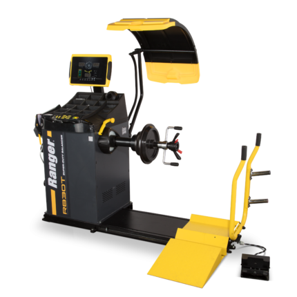 Hybrid wheel balancing machine with wheel lift