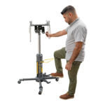 Technician using a Ranger RTJ-1 telescoping transmission jack, adjusting the saddle while pumping the foot pedal