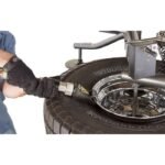 Bead-blaster nozzle injecting high-pressure air to seat stubborn tire beads on the Ranger R980XR tire-changing platform