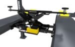 BendPak RJ9W rolling bridge jack lifting a vehicle for full wheel service, featuring high-pressure hydraulics and easy-roll wheels.