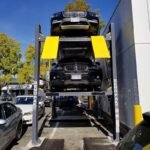 Three Cars Stacked in Bendpak Parking lift