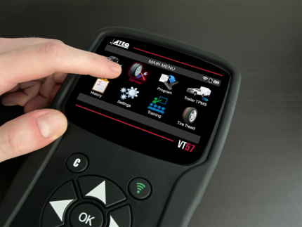 Technician using VT57 touchscreen to perform TPMS sensor diagnostics